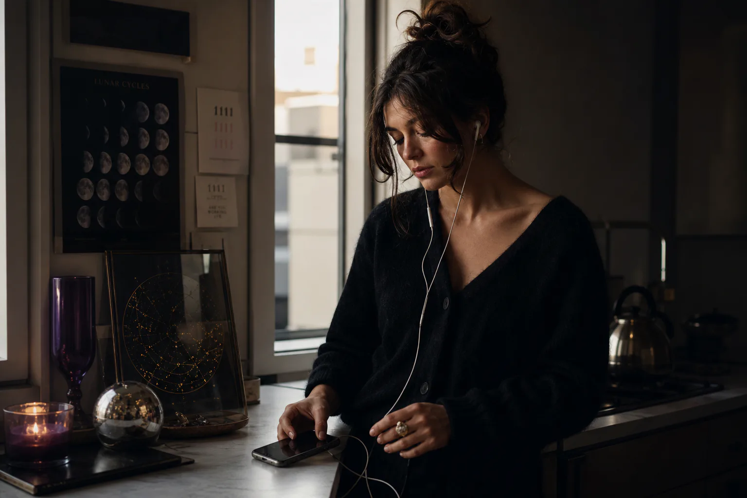 Person listening to audio beside a quiet window