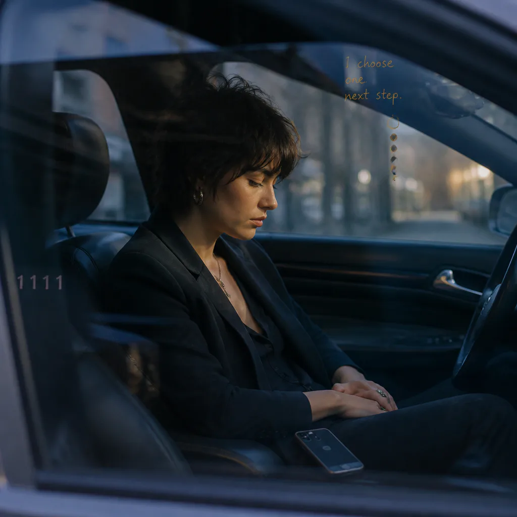 Person sitting quietly in a parked car