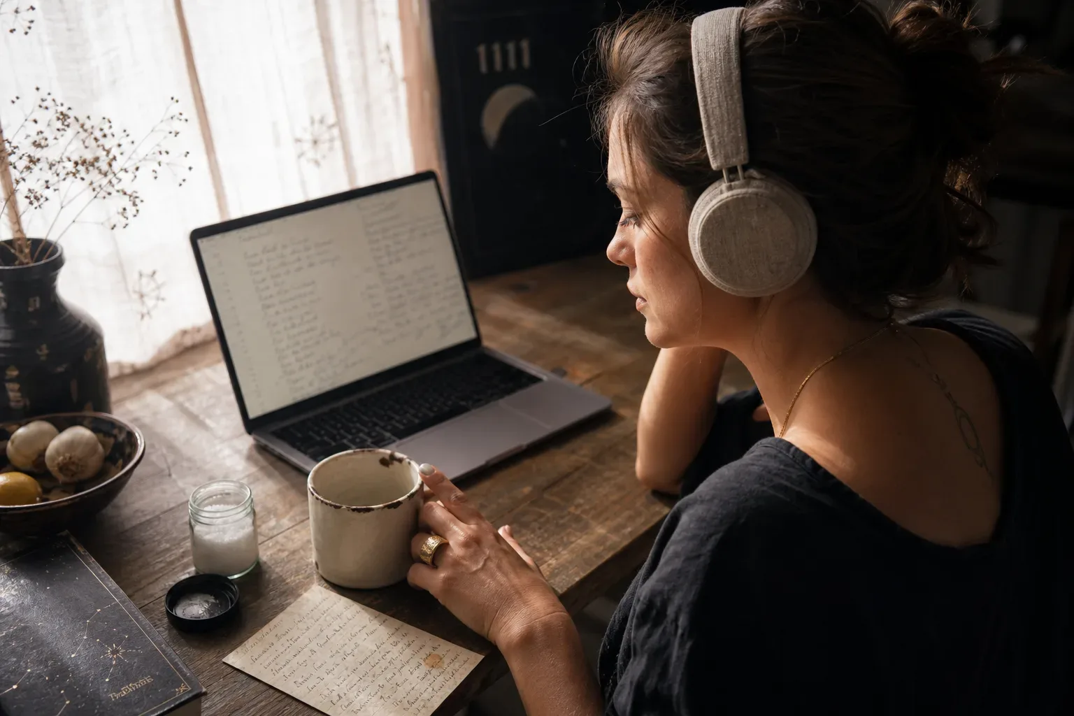 Woman listening quietly beside an unfinished handwritten recipe